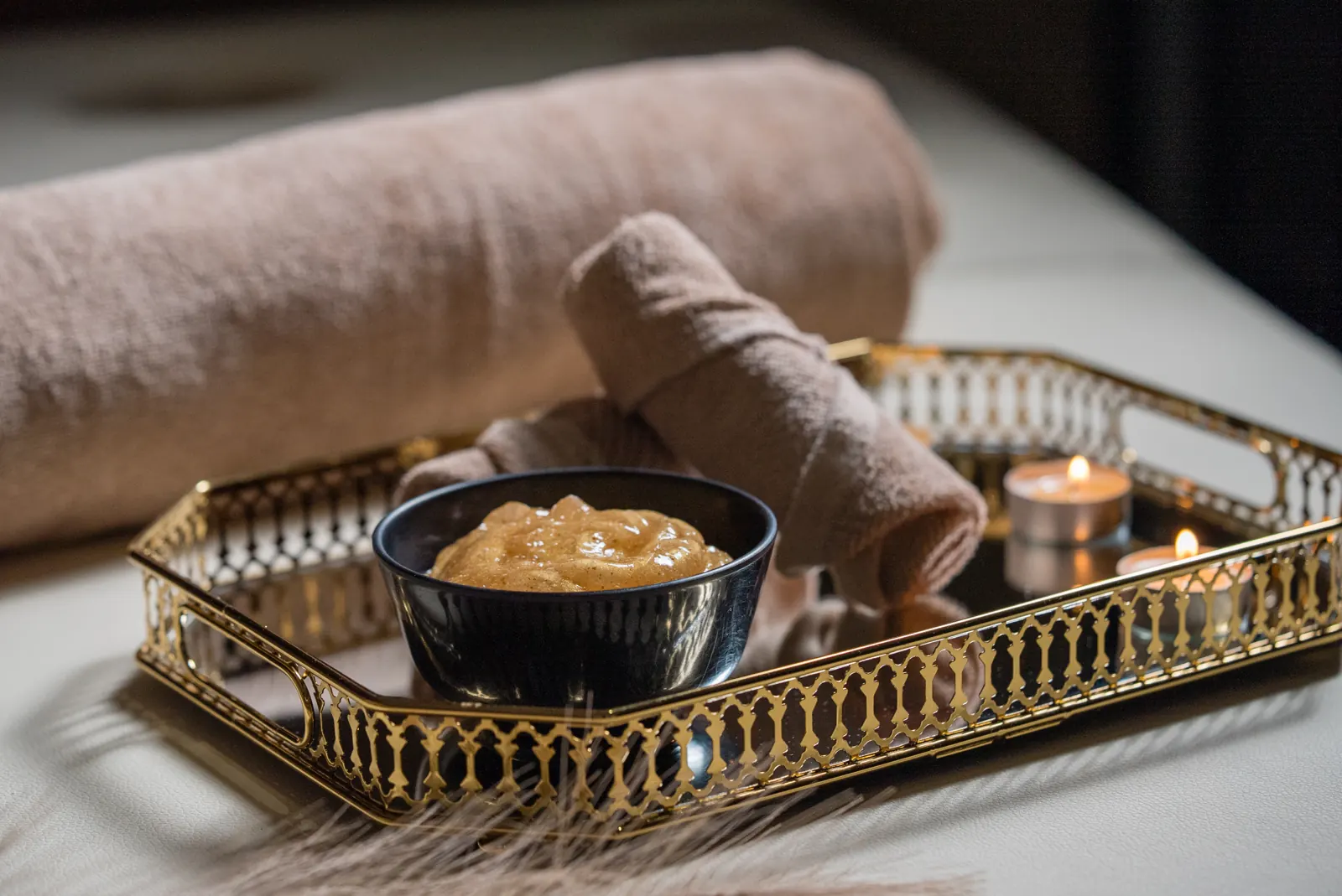 Spa scrub ritual set on a gold tray